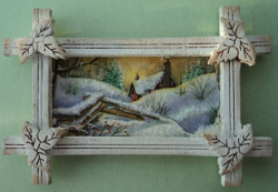 Leaf frame with cottage scene